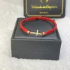 PULSERA TEJIDA CRUZ